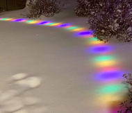 Christmas lights under fluffy snow.jpg