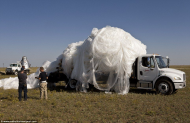 Tangled - It took Baumgartner crew members 45 minutes to lasso 40 acres of material weighing 3,708lbs and load it into a large open truck.jpg