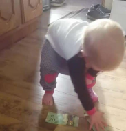 This toddler stuffing money into her pants perfectly sums up parenting.jpg