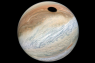 Eerie black spot on Jupiter the size of EARTH spotted by Nasa probe – and it’s actually an eclipse caused by fiery ‘volcano moon’.jpg