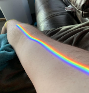 A vibrant and clear spectrum of colors refracting through my apparently prismatic window onto my arm.jpg