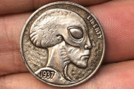 Man Discovers 'Extraterrestrial' Coin in Roll of Quarters.jpg